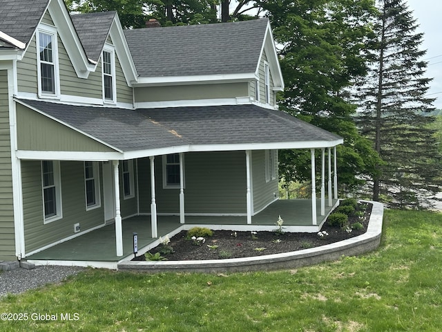 1108 State Route 295, Chatham, NY 12060 - view of home's exterior featuring roof with shingles, a lawn, and covered porch
