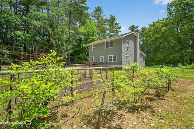 175 Library Ave, Warrensburg, NY 12885 - rear view of property featuring a vegetable garden
