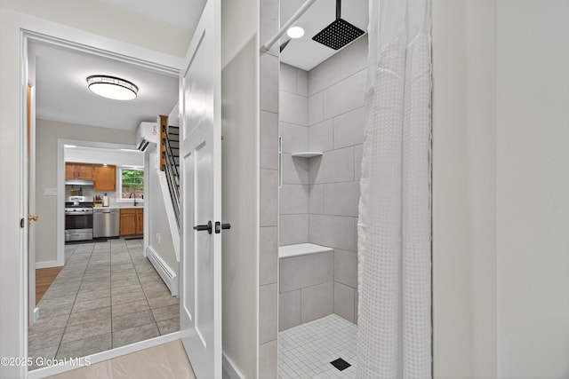 175 Library Ave, Warrensburg, NY 12885 - full bathroom with a tile shower, an AC wall unit, vanity, and a baseboard heating unit