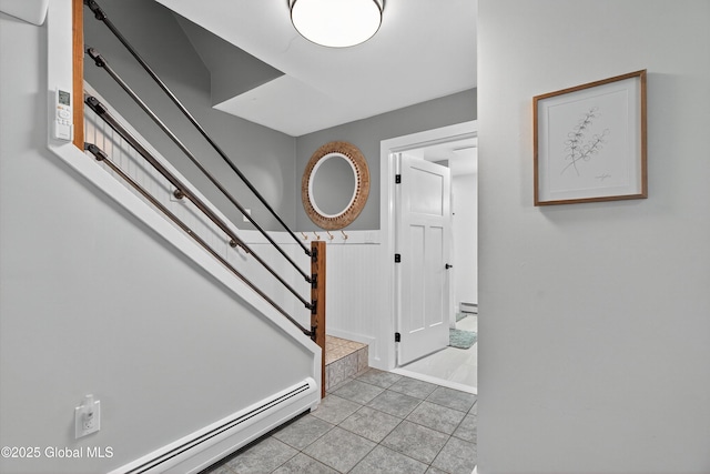 175 Library Ave, Warrensburg, NY 12885 - stairs featuring a baseboard heating unit and tile patterned floors