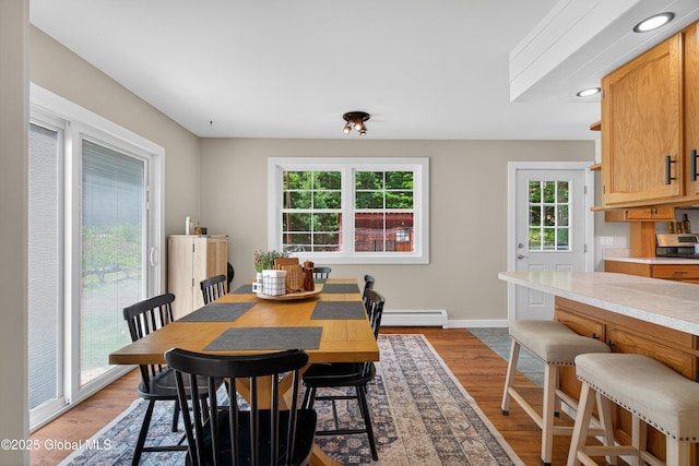 175 Library Ave, Warrensburg, NY 12885 - dining room with a baseboard radiator, light wood-style floors, and recessed lighting
