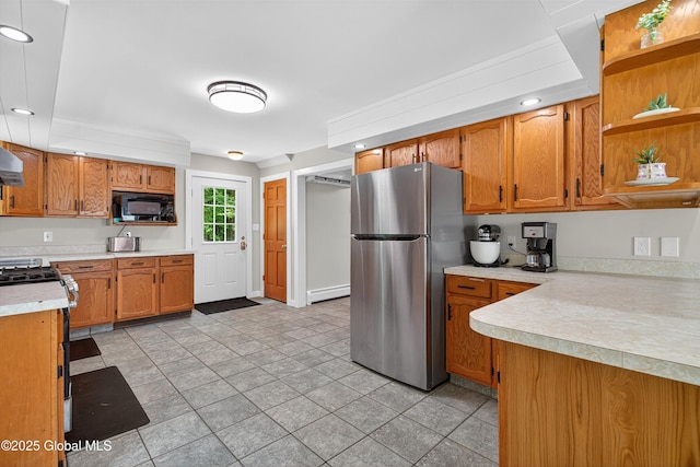 175 Library Ave, Warrensburg, NY 12885 - kitchen with freestanding refrigerator, black microwave, open shelves, baseboard heating, and light countertops