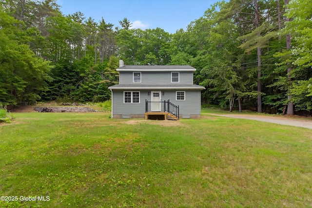175 Library Ave, Warrensburg, NY 12885 - view of front of home featuring a chimney and a front yard