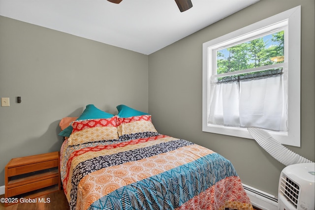 175 Library Ave, Warrensburg, NY 12885 - bedroom featuring baseboard heating and ceiling fan