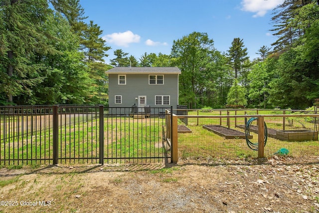 175 Library Ave, Warrensburg, NY 12885 - back of house featuring a vegetable garden