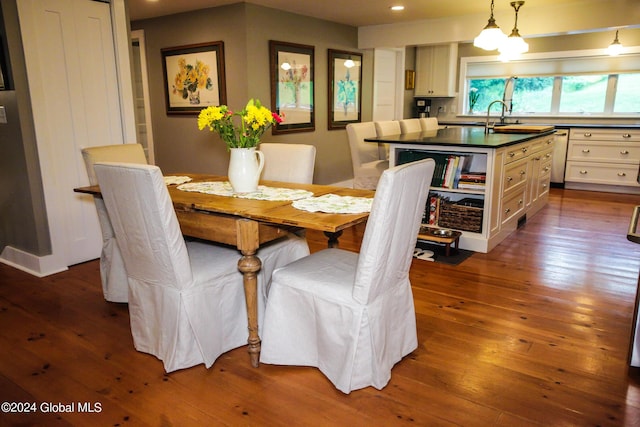 dining space featuring recessed lighting and dark wood-style flooring