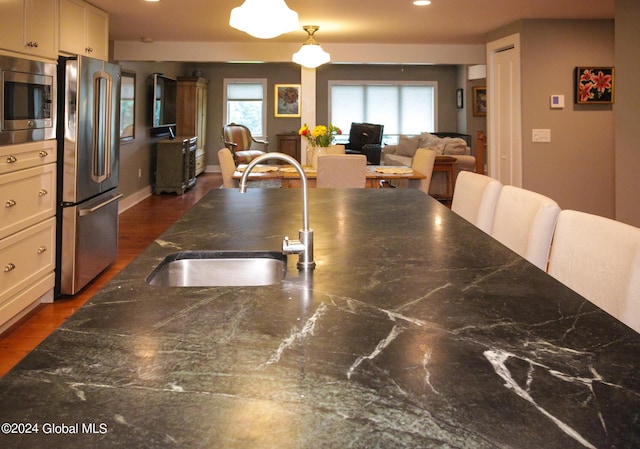 dining space featuring recessed lighting and dark wood-style floors