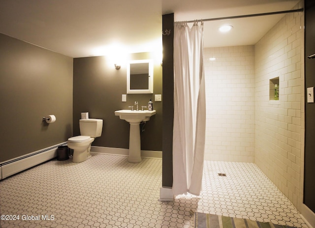 bathroom with toilet, a shower stall, and baseboard heating