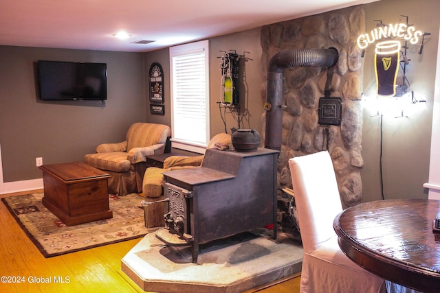 living area featuring hardwood / wood-style floors and visible vents