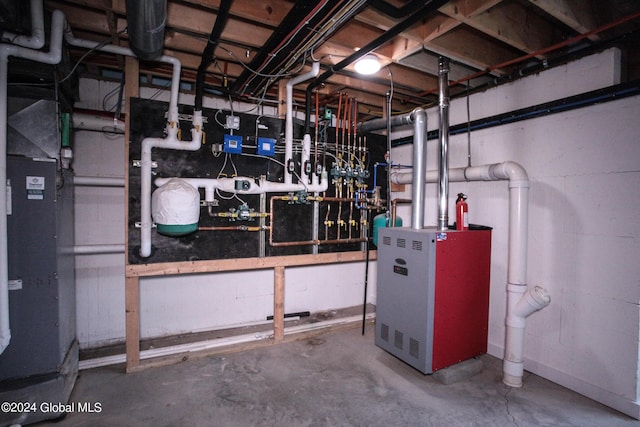 utility room featuring heating unit and a heating unit
