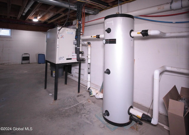 utility room featuring water heater