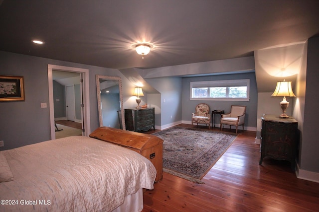 bedroom featuring wood-type flooring, recessed lighting, and baseboards