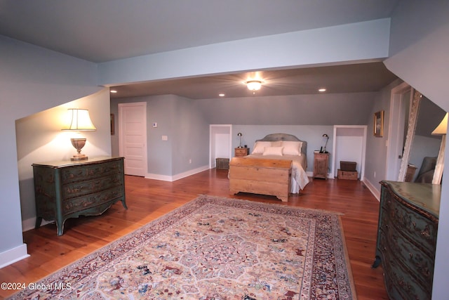 bedroom with baseboards, recessed lighting, and wood finished floors