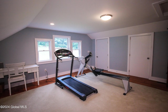 exercise room with baseboards, recessed lighting, wood finished floors, and lofted ceiling