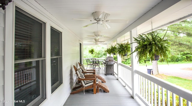 balcony with a ceiling fan, covered porch, and area for grilling