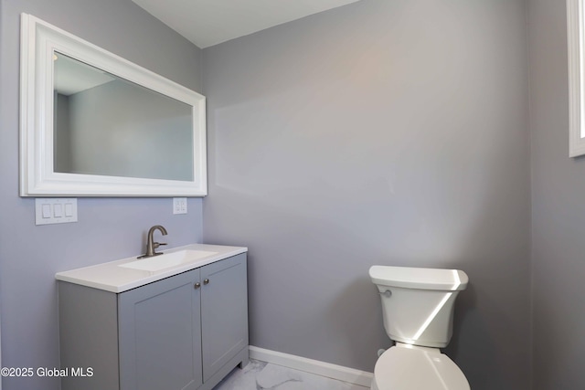 701 Engleman Ave, Glenville, NY 12302 - half bathroom featuring marble finish floors, vanity, toilet, and baseboards