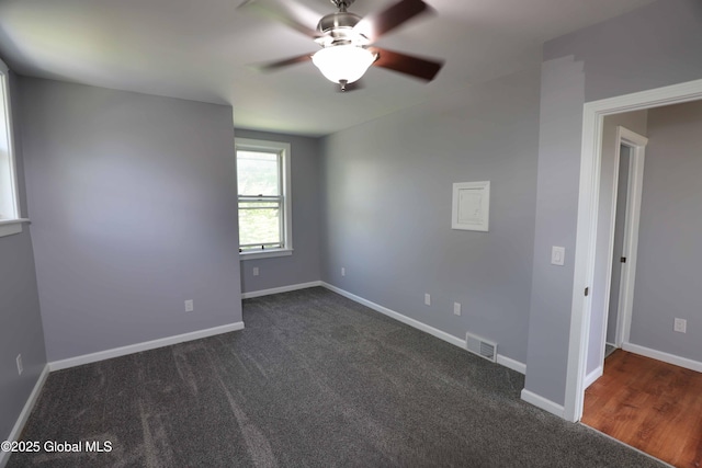 701 Engleman Ave, Glenville, NY 12302 - unfurnished room with ceiling fan, dark colored carpet, and baseboards