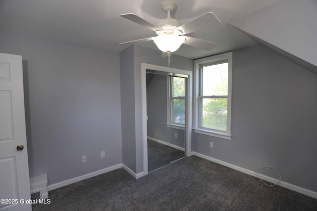 701 Engleman Ave, Glenville, NY 12302 - unfurnished bedroom featuring dark carpet, baseboards, and ceiling fan