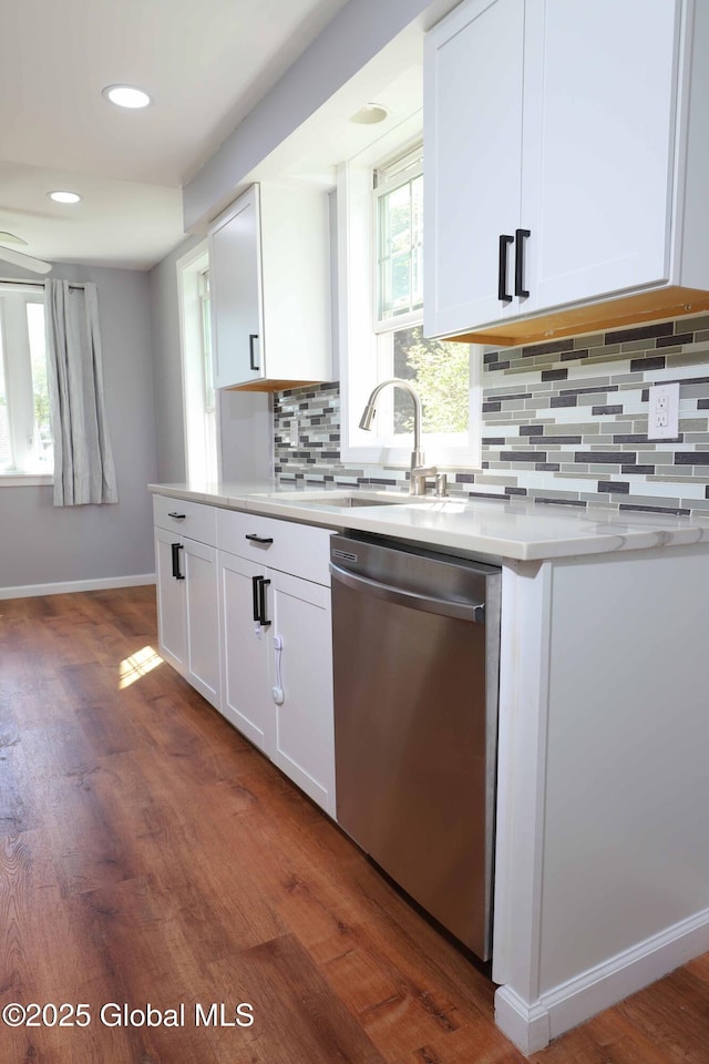 701 Engleman Ave, Glenville, NY 12302 - kitchen with dishwasher, white cabinets, dark wood finished floors, decorative backsplash, and recessed lighting