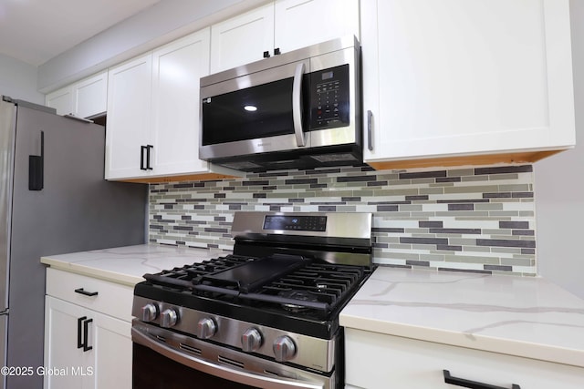 701 Engleman Ave, Glenville, NY 12302 - kitchen featuring stainless steel appliances, white cabinetry, and tasteful backsplash