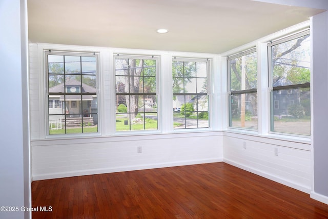 701 Engleman Ave, Glenville, NY 12302 - unfurnished sunroom featuring baseboards, wood-type flooring, and plenty of natural light