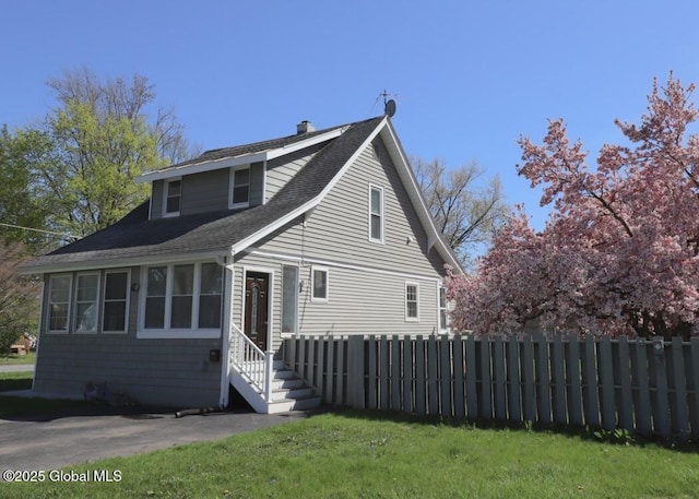 701 Engleman Ave, Glenville, NY 12302 - view of front facade featuring fence, entry steps, a shingled roof, and a chimney
