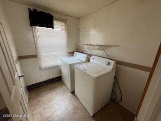 washroom with laundry area and washer and dryer