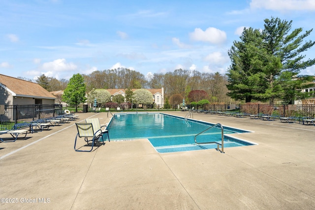 pool featuring fence and a patio