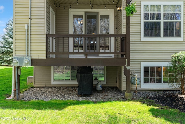 back of house with a yard and a deck