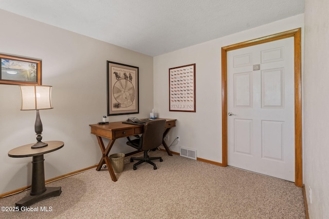 home office featuring visible vents, carpet flooring, and baseboards