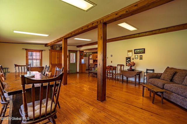 dining area featuring light wood-style floors