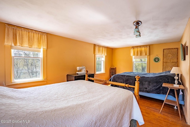 bedroom featuring wood finished floors