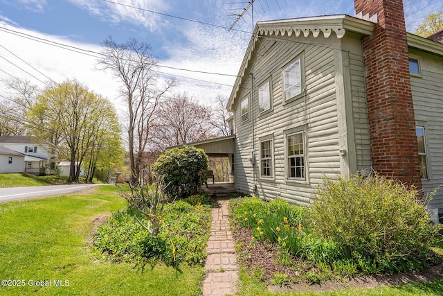view of home's exterior featuring a chimney