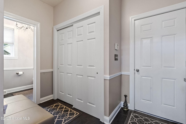doorway to outside with baseboards