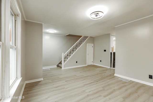 37 Nelson Ave, Rensselaer, NY 12144 - unfurnished living room with light wood-style flooring, stairs, and baseboards