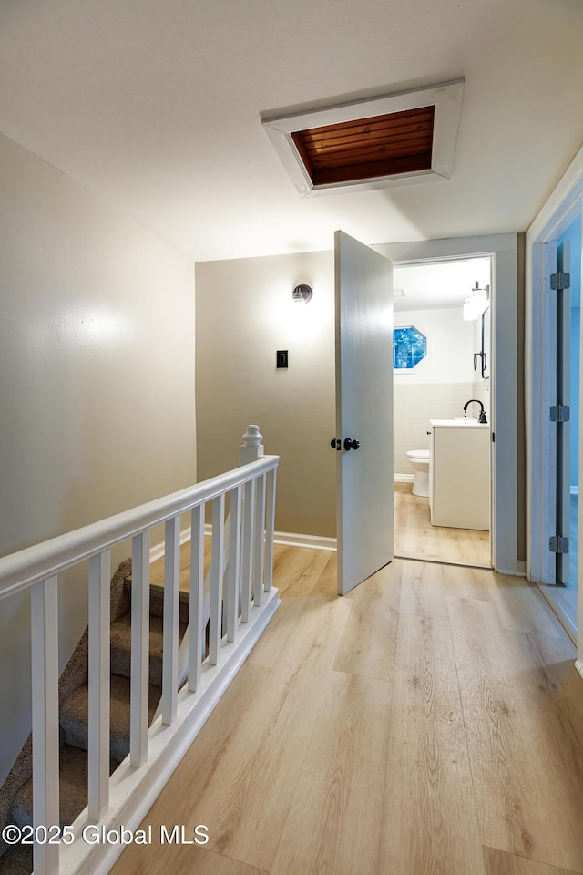 37 Nelson Ave, Rensselaer, NY 12144 - hallway featuring light wood-style floors and an upstairs landing