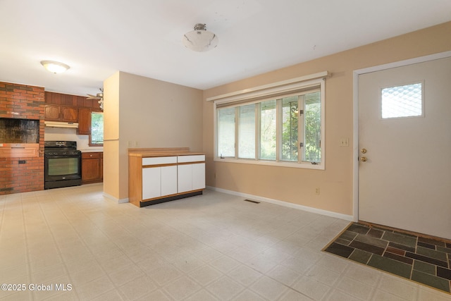 entryway with light flooring and baseboards