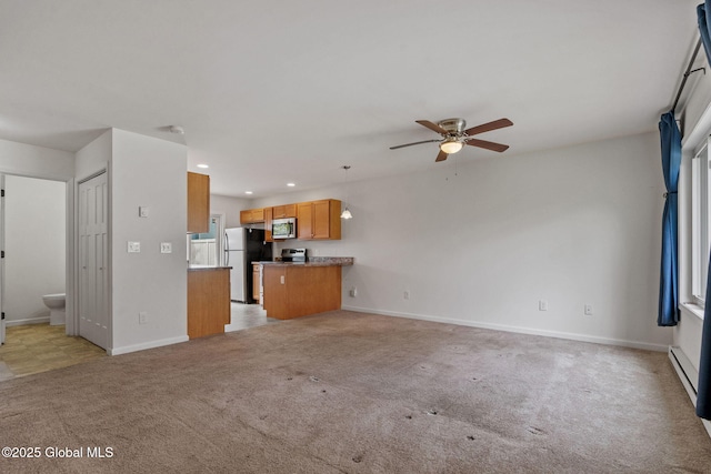 unfurnished living room featuring light colored carpet, baseboards, ceiling fan, and recessed lighting