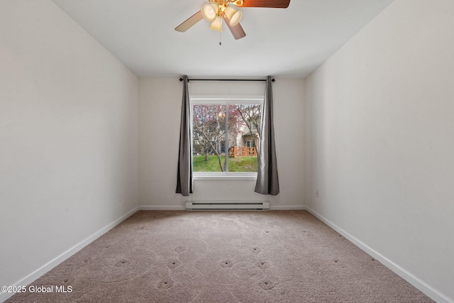 carpeted spare room featuring a ceiling fan, baseboards, and baseboard heating