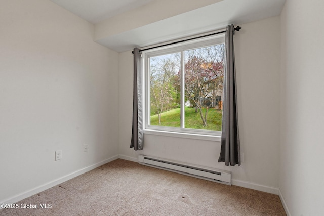 carpeted spare room featuring baseboards and baseboard heating