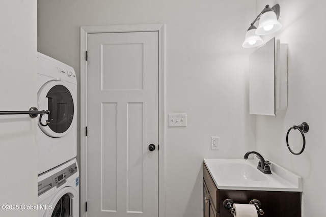 bathroom featuring vanity and stacked washer / drying machine