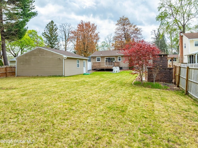 view of yard with a deck and a fenced backyard