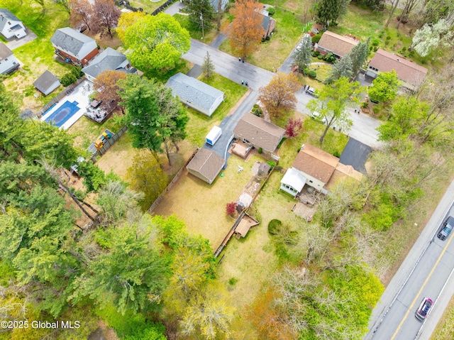 birds eye view of property with a residential view