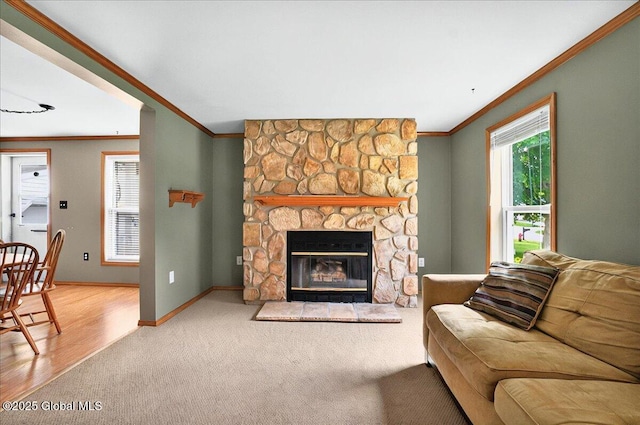 23 Hilton Dr, Moreau, NY 12803 - living area with ornamental molding, carpet floors, a stone fireplace, and baseboards