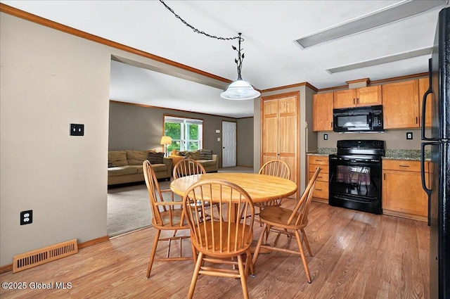 23 Hilton Dr, Moreau, NY 12803 - dining room with light wood-type flooring, ornamental molding, and baseboards