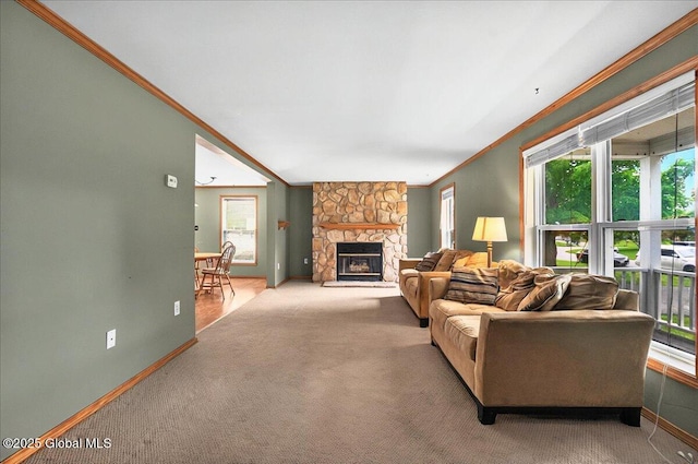 23 Hilton Dr, Moreau, NY 12803 - living room with ornamental molding, baseboards, a stone fireplace, and carpet floors