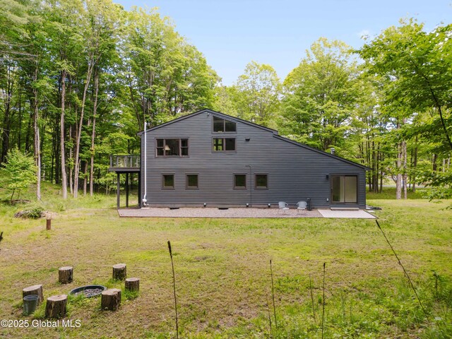 829 Jefferson Rd, Nassau, NY 12123 - back of property featuring a yard, a wooden deck, a patio area, and view of scattered trees