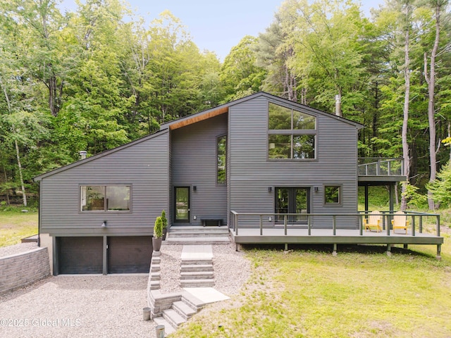 829 Jefferson Rd, Nassau, NY 12123 - view of front facade with an attached garage, a wooden deck, driveway, and a front yard