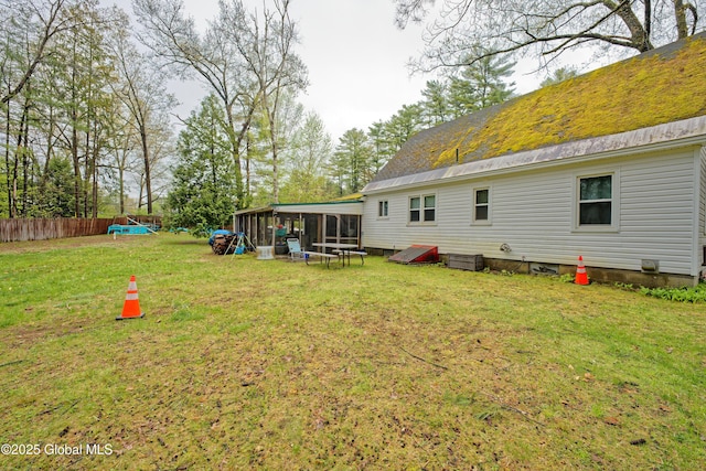 back of property featuring a sunroom