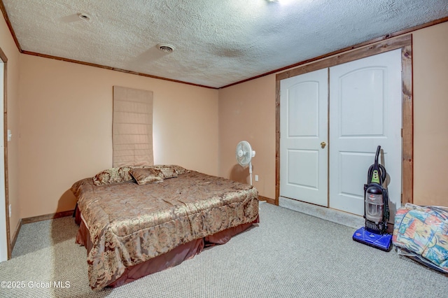 carpeted bedroom featuring crown molding, a textured ceiling, and baseboards